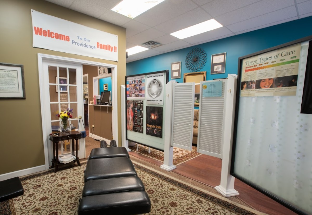 Welcome to Providence Family Chiropractic in Lansing, MI — reception area with patient education displays